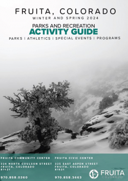 The cover of the 2024 Winter and Spring Fruita Parks and Recreation Activity Guide. The photo features a snow covered juniper. 